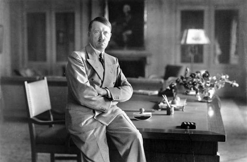 Adolf Hitler Sitting On Desk